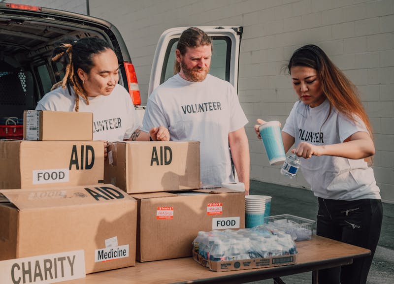Volunteers sorting donation boxes