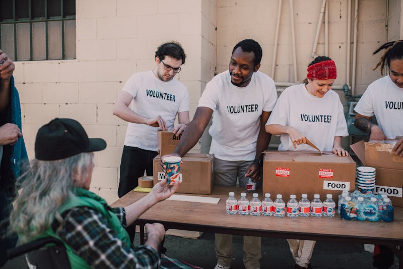 Volunteers preparing food hamper donations