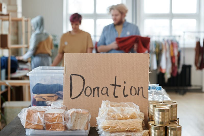 Volunteers packing food hampers at a table